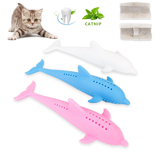 Three fish-shaped silicone cat molar sticks in blue, pink, and white laid out with catnip and a kitten nearby