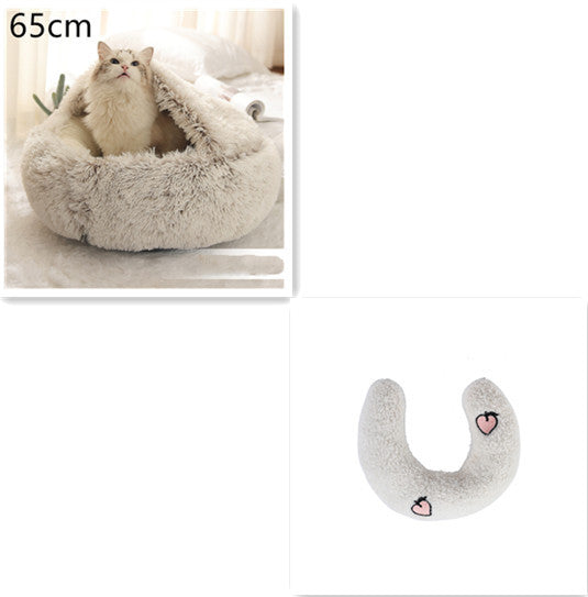 Beige dome bed 65cm with off white U-shaped pillow featuring peach embroidery
