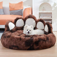 Load image into Gallery viewer, Brown bear paw plush dog bed with white dog lying comfortably in living area
