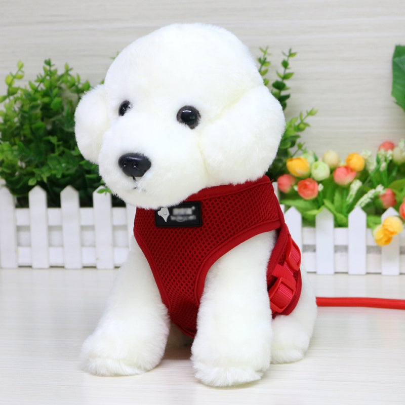 White plush dog model wearing red mesh harness