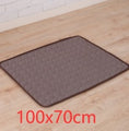 Cargar la imagen en la vista de la galería, Brown pet cooling mat displayed flat on wooden floor, size 100x70 cm
