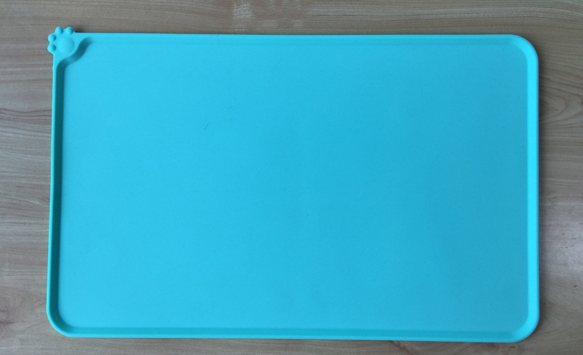 Non-slip silicone mat under dog feeding bowls to prevent sliding on floor  
