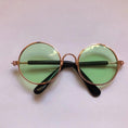 Load image into Gallery viewer, Minimalist display of round frame pet sunglasses with dark lenses on white background
