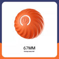 Cargar la imagen en la vista de la galería, Close-up of orange LED interactive jumping ball with spiral textured surface and power button
