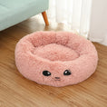 Load image into Gallery viewer, Pink plush round pet bed placed on wooden floor with embroidered face
