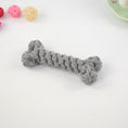 Load image into Gallery viewer, Close-up of gray braided cotton rope dog chew toy in bone shape on white background
