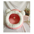 Load image into Gallery viewer, Pink and white plush cat cave bed with round ears and pompom toy on white surface next to dried flowers
