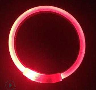 Duplicate image of red glowing LED dog collar illuminated in dark