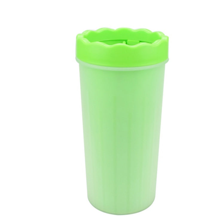 Green silicone dog paw washer cup upright on white background