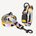 Load image into Gallery viewer, Set of dog collar and matching leash in purple, yellow, and black geometric pattern displayed on white background
