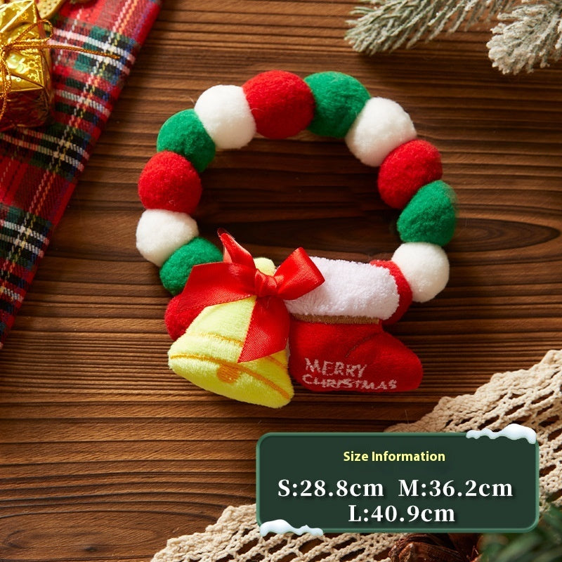 Plush Christmas collar with red and green felt balls featuring festive golden bells and a stocking ornament embroidered with 'Merry Christmas'