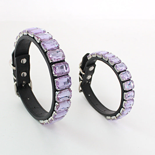 Close-up of light purple rhinestone PU pet collars in two sizes on a white background