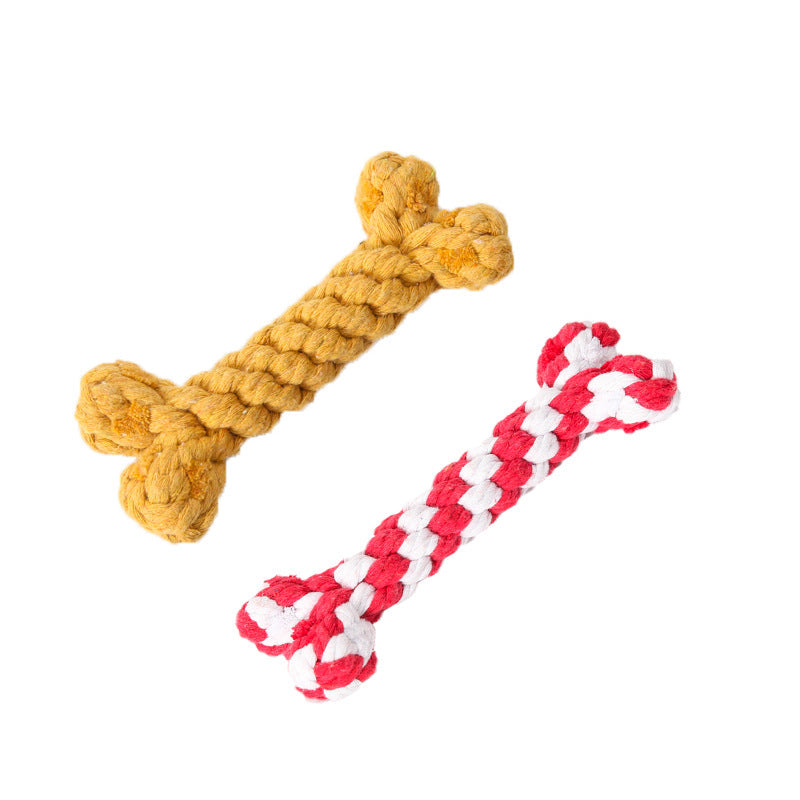 Yellow and red & white braided cotton rope dog chew toys in bone shapes isolated on white background