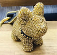 Charger l'image dans la visionneuse de la galerie, Gold crystal dog keychain displayed on a wooden surface highlighting the intricate crystal coverage and studded collar
