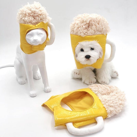 Small white dog wearing yellow beer mug cosplay hat with plush foam top