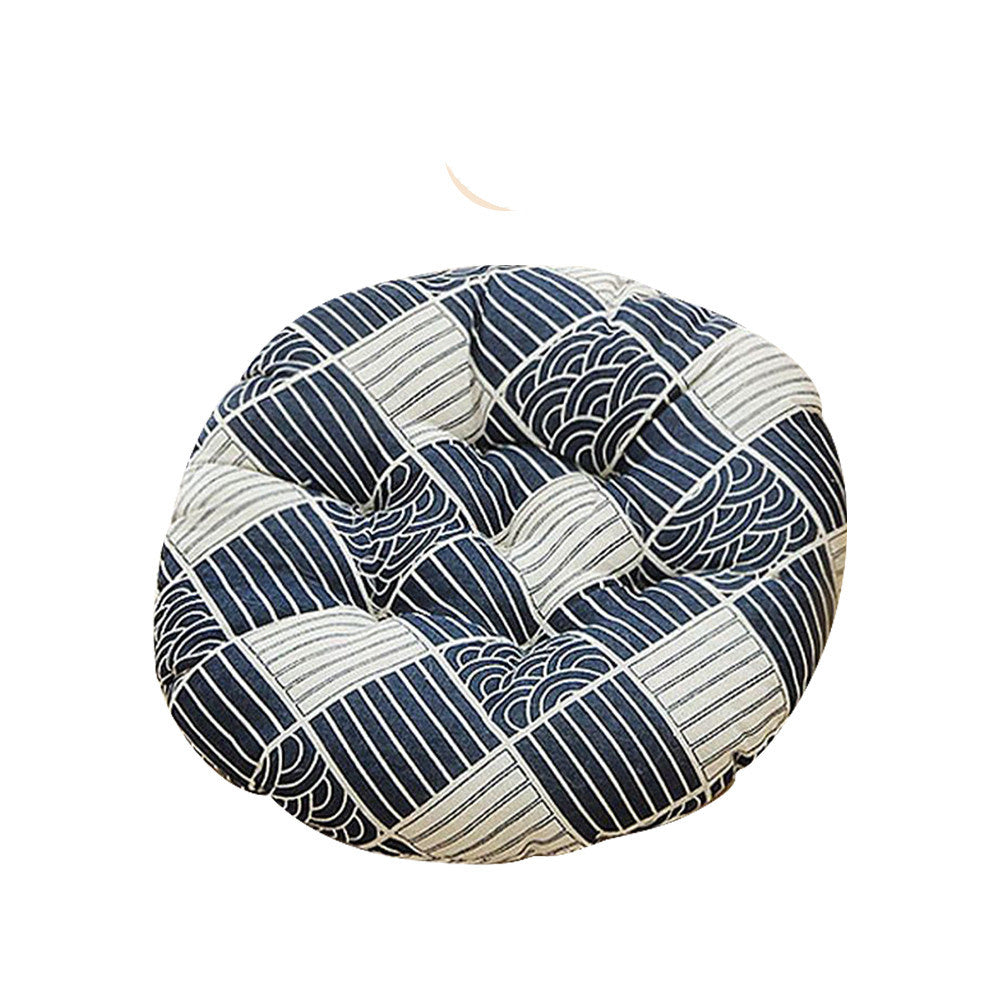 Blue and white tufted round cushion designed to fit inside rattan cat bed