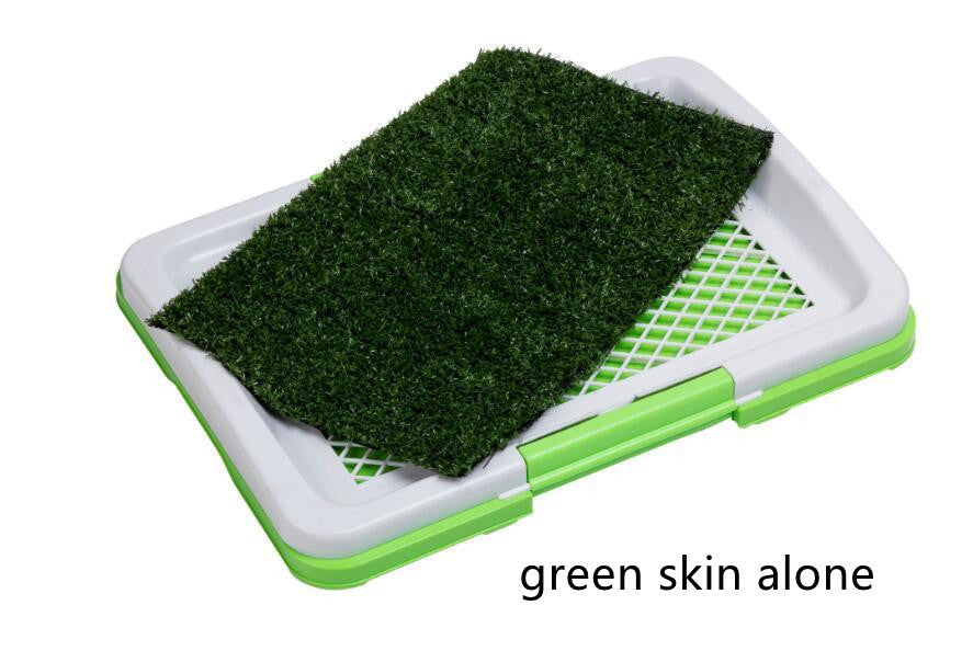 Close-up of artificial grass layer on the dog potty tray with green and gray frame