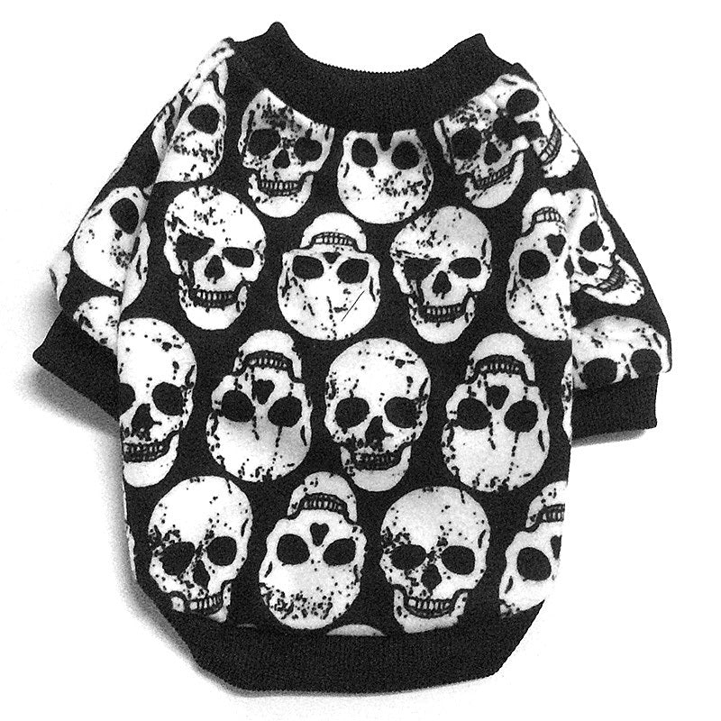 Flat lay of black and white distressed skull print dog shirt with black trims