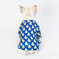 Load image into Gallery viewer, Back view of a white dog wearing the blue duck print shirt, seated facing away
