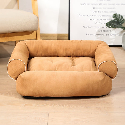 Tan velvet pet sofa bed with cushioned sides in stylish indoor setting