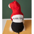 Load image into Gallery viewer, Back view of small dog wearing red, black, and white jacket with hood, showing adjustable drawstring hem and bold text across the back
