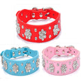 Load image into Gallery viewer, Close up of pink, blue, and red rhinestone dog collars showing floral design
