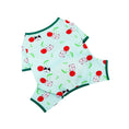 Charger l'image dans la visionneuse de la galerie, Flat lay of mint green dog pajamas decorated with cherry and dog faces pattern
