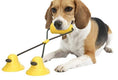 Load image into Gallery viewer, Brown corn-shaped chew toy with rope and dog holding the toy

