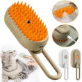 Cargar la imagen en la vista de la galería, Close-up of beige massage brush with orange silicone bristles showing spray function and USB charging port
