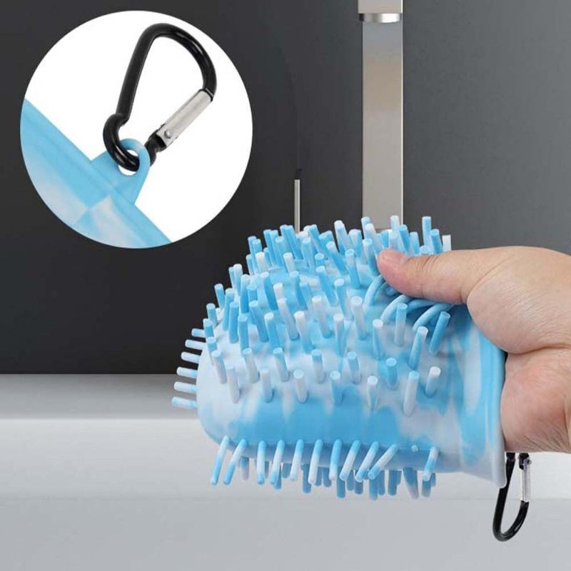 Close-up of blue silicone paw cleaner with carabiner clip