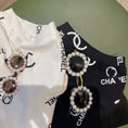 Load image into Gallery viewer, Two pairs of pearl frame round pet sunglasses on black and white printed pet clothes
