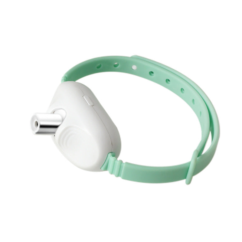 Close-up of mint green silicone laser collar with white laser housing