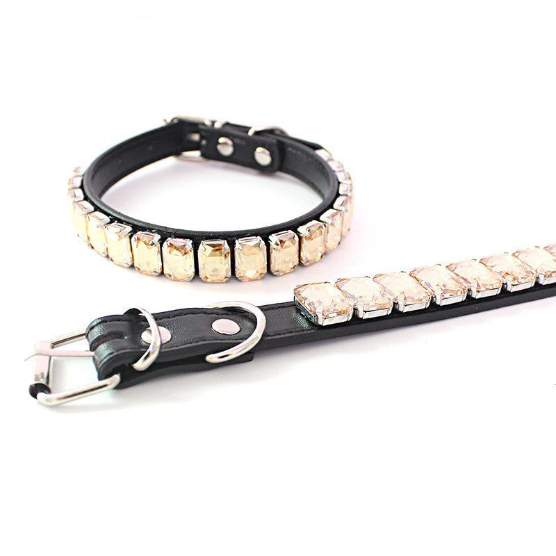 Light beige rhinestone PU pet collar laid flat with close-up of buckle and D-ring