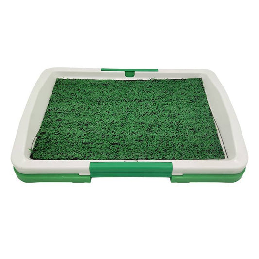 Indoor dog potty training toilet with white and green frame and artificial grass patch top view