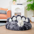 Load image into Gallery viewer, Gray bear paw shaped plush dog bed with small white dog resting inside in modern living room
