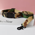 Load image into Gallery viewer, Camouflage patterned nylon dog collar with black plastic buckle and matching leash on white box
