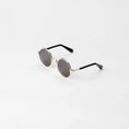 Load image into Gallery viewer, Side profile of cat sunglasses highlighting smooth black arms and round frame   
