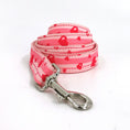Load image into Gallery viewer, Close-up of pink leash with red hearts and metal clasp
