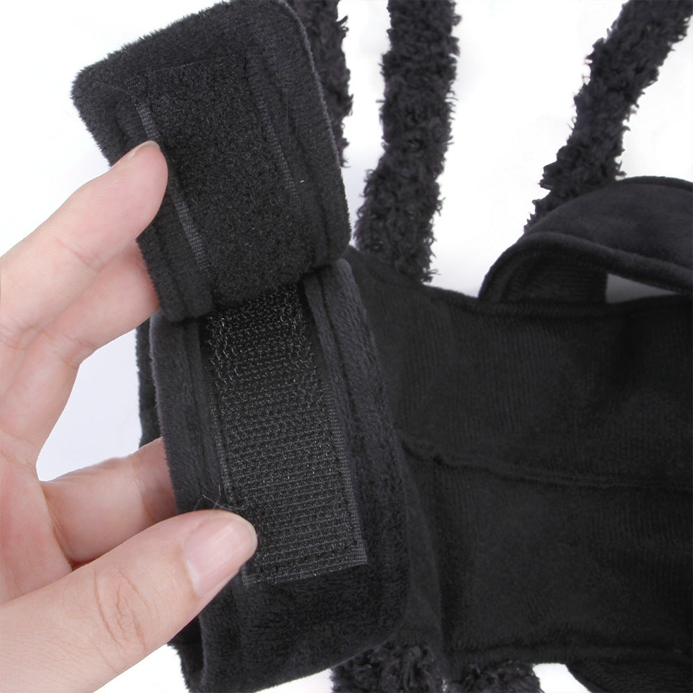 Close-up of adjustable Velcro strap on black plush spider pet costume