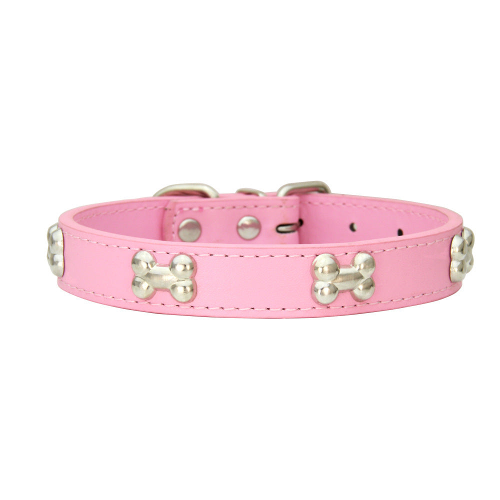 Pink PU leather dog collar with silver bone studs close-up