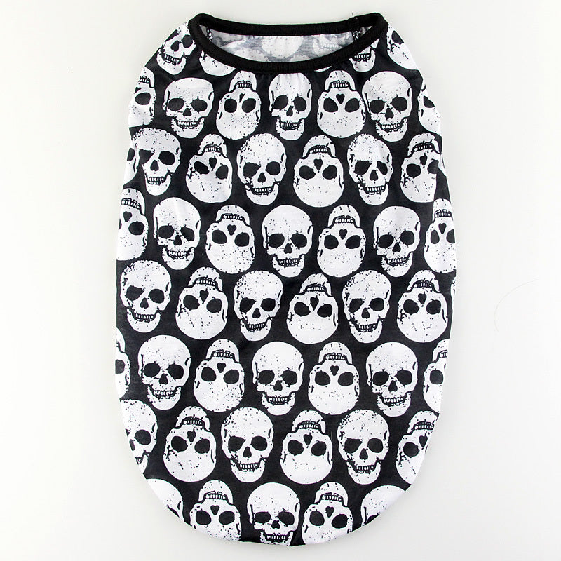 Flat lay of white dog shirt with black skull print and black neckline trim