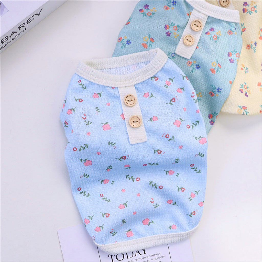 Front view of blue floral dog pajamas with decorative wooden buttons