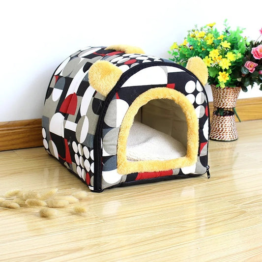 Geometric patterned plush pet kennel with yellow faux bear ears on wooden floor