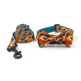 Load image into Gallery viewer, Rolled matching tropical floral dog leash and collar with attached bow tie shown on white background
