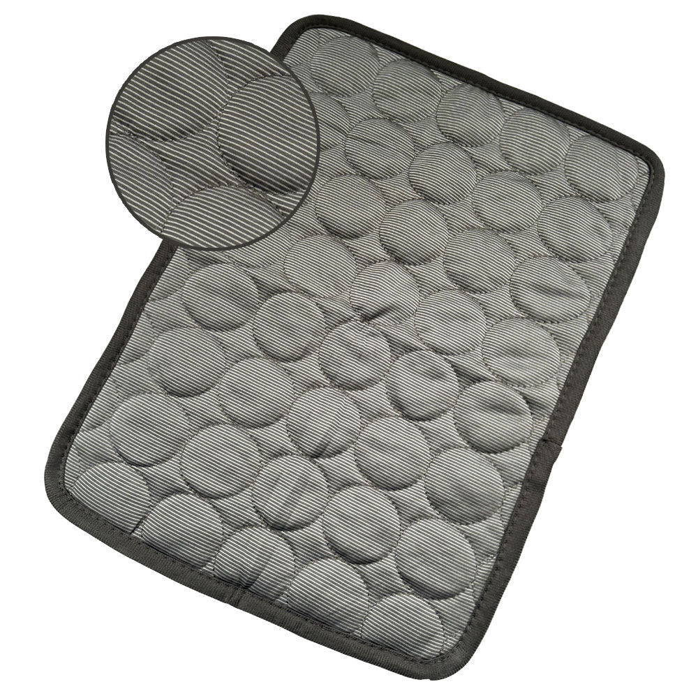 Close-up of gray quilted pet cooling mat with striped pattern