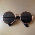 Load image into Gallery viewer, Fashionable round pet sunglasses with brown tinted lenses in sunlight  
