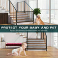 Cargar la imagen en la vista de la galería, Black mesh safety gate fitted between metal and wooden staircase rails with baby crawling on floor and dog nearby, text overlay about protection
