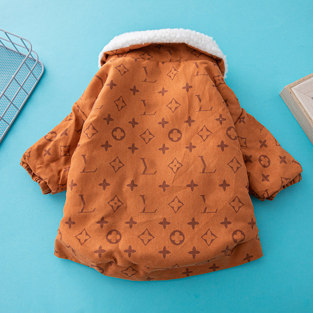Back view of orange-brown dog jacket showing soft fabric and pattern detail on blue background