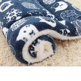 Load image into Gallery viewer, Rolled navy blue pet blanket featuring white owl and cat silhouettes with fleece backing

