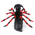 Load image into Gallery viewer, Gray kitten wearing black and red spider pet costume harness sitting on white background

